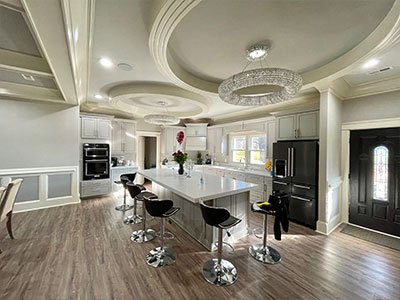 Open space kitchen with decorative ceiling and a kitchen island