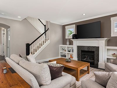 small living room brown wall white stairs